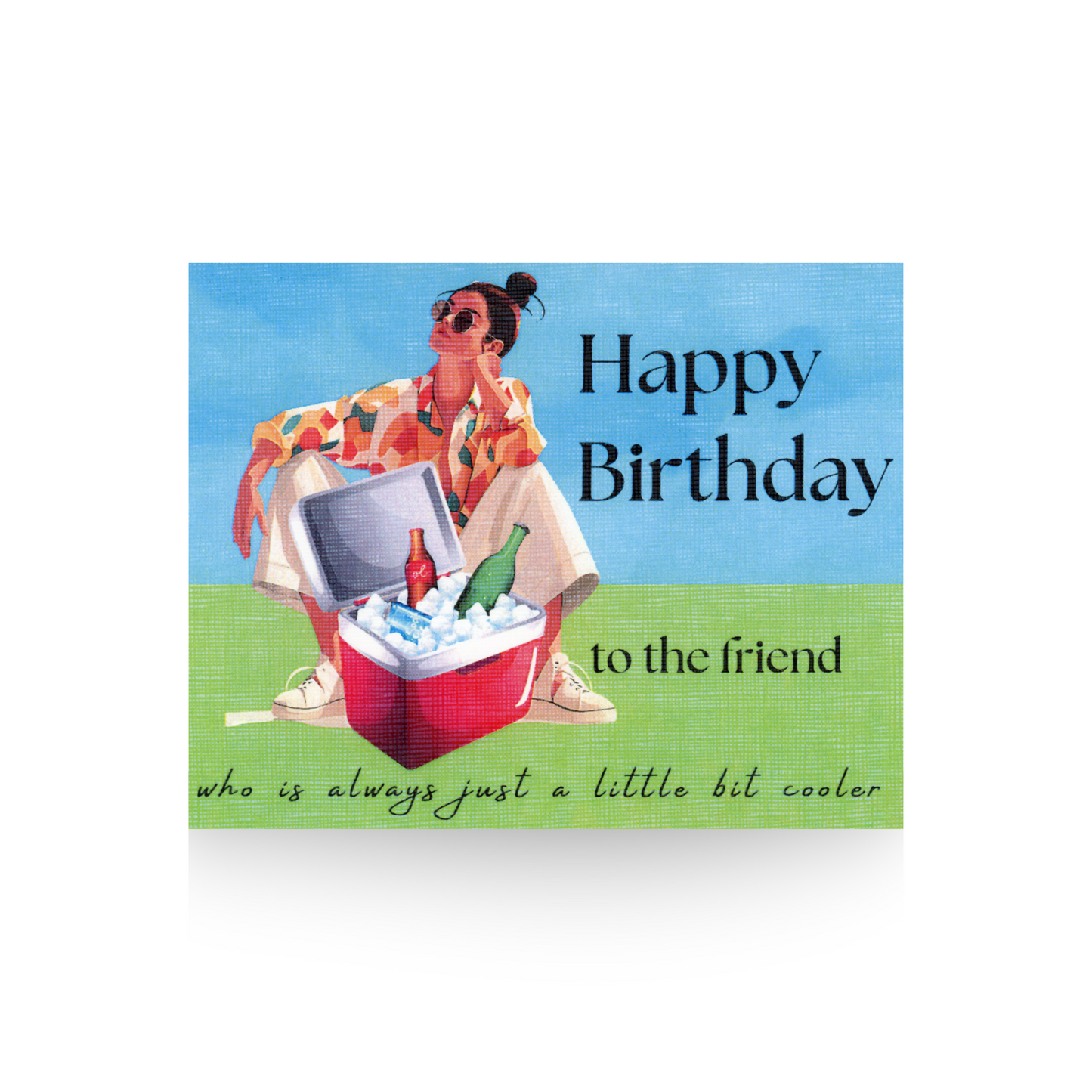 This birthday card features a modern woman in a printed blouse and white pants sitting in a crouched position behind a red cooler filled with ice and bottles. The background is blue and the base is green. The message "Happy Birthday to the friend who is always just a little bit cooler" is written on the card