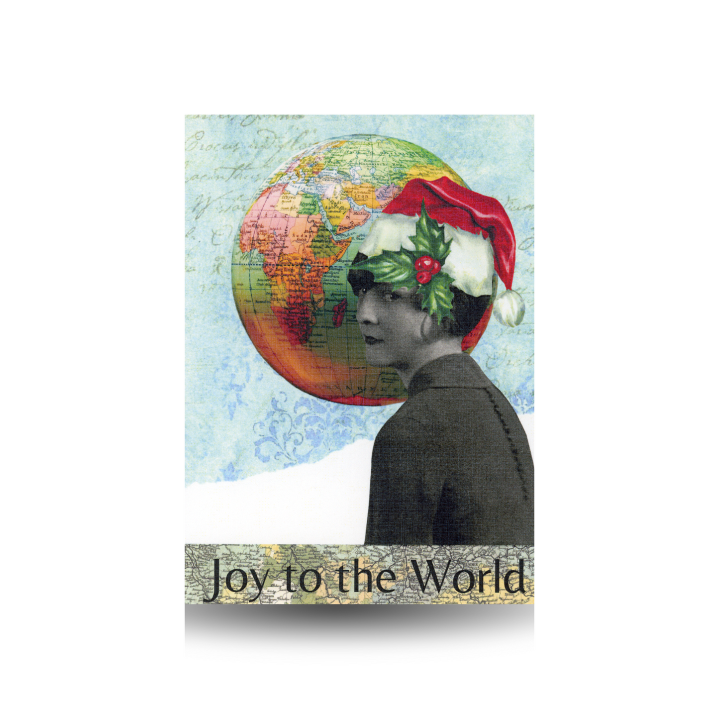 This Christmas card features a black and white photo of a vintage woman wearing a red Santa hat with a holly sprig on the brim. There is a vintage globe in the sky. The sky is a blue print with script across is. There is snow at the bottom, and at the base of the card there is a green vintage map where the message "Joy to the World" is written.