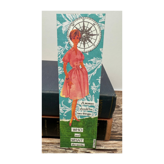 This paper collaged bookmark features a retro lady in a pink dress and short hair standing against a blue printed background and on a green ground, with a compass by her head.