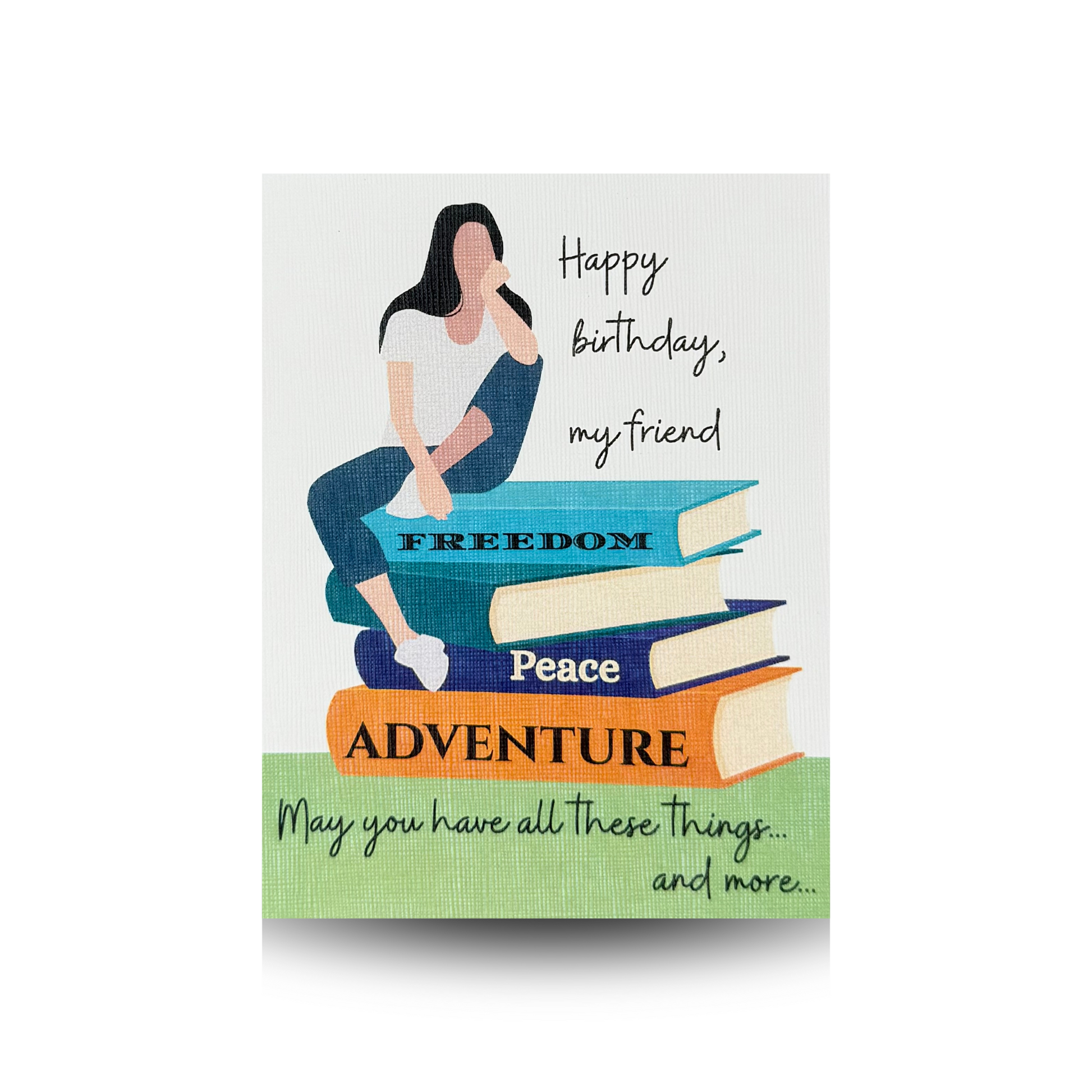 This birthday card features a modern woman in blue jeans, white sneakers, and a white t-shirt, sitting atop a stack of books.  On the spines of the books appear the words freedom, peace, and adventure.  The background is white, and the bottom of the card is green.  The greeting "Happy birthday, my friend" appears to the right of the lady and the greeting "May you have all these things...and more..." is written at the bottom of the card