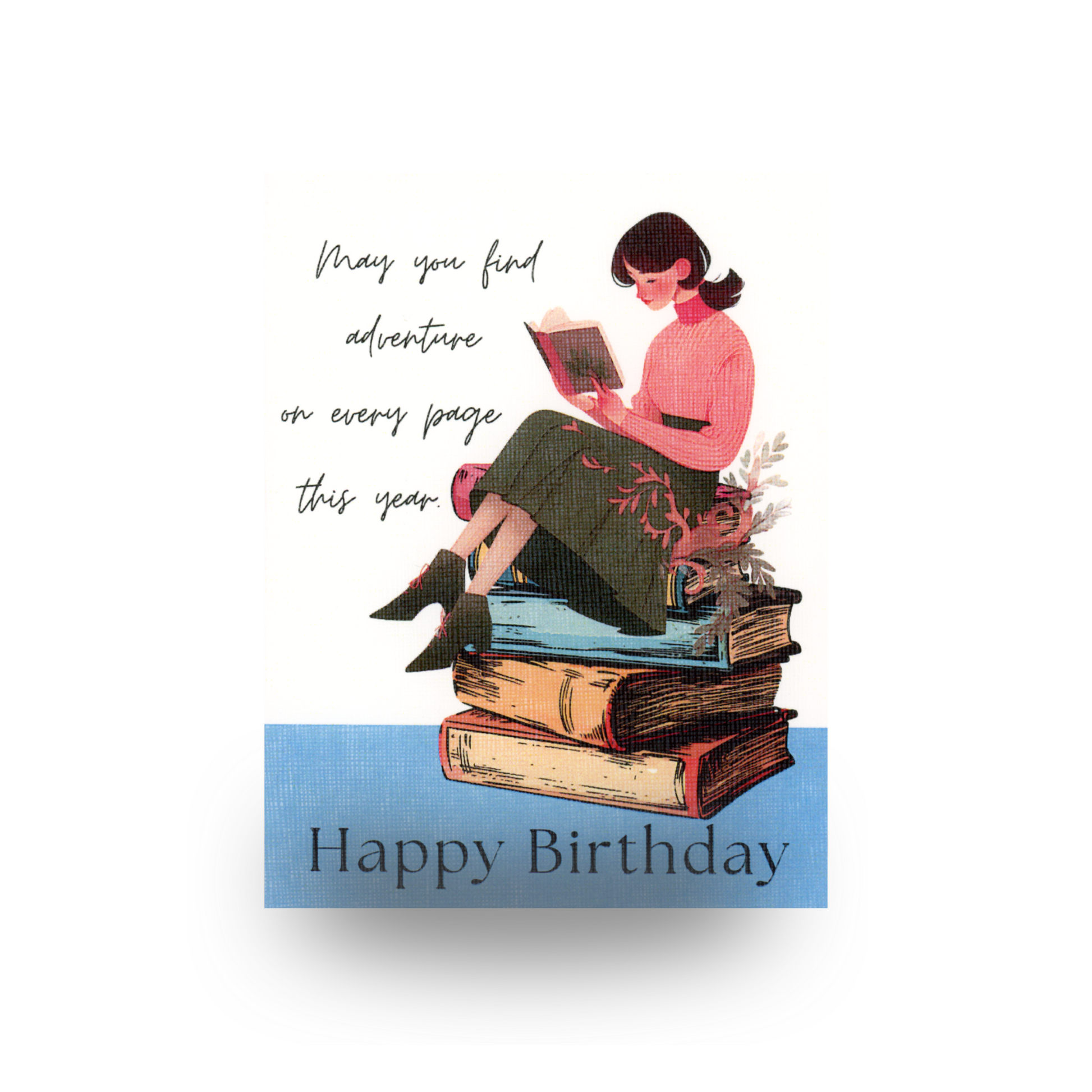 This birthday card features an illustrated vintage young woman reading a book, sitting on a stack of books.  She has on ankle boots, a dark skirt, a pink sweater, and has her hair pulled back in a ponytail.  She is sitting on a stick of 5 books.  The background is white and the bottom is blue.  The greeting is written in script to the left of the scene and Happy Birthday is written on the base of the card