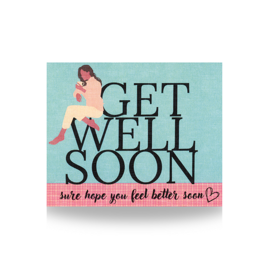 This GET WELL SOON greeting card features a woman with bare feet wearing white pants and pink sweater, sitting on the "W" of WELL and leaning on the "G" in GET.  The background is blue and the base is pink gingham.  The phrase "sure hope you feel better soon" is on the bottom part of the card, along with a black heart outline