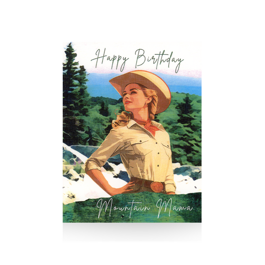 This birthday card features a mountain scene.  Standing in front of the mountain scene is a retro cowgirl dressed in a tan shirt and hat.  Her hand is on her hip and she is looking to the side.  The greeting "Happy Birthday Mountain Mama is written on the top and bottom of the card