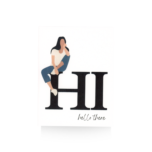 This greeting card features a white background upon which a large HI is written and below it in smaller cursive font is "hello there."  Perched on top of the "H" is a modern lady in blue jeans and a white-t-shirt.  She has one leg propped up and her elbow is resting on her knee and her hand is on her chin.