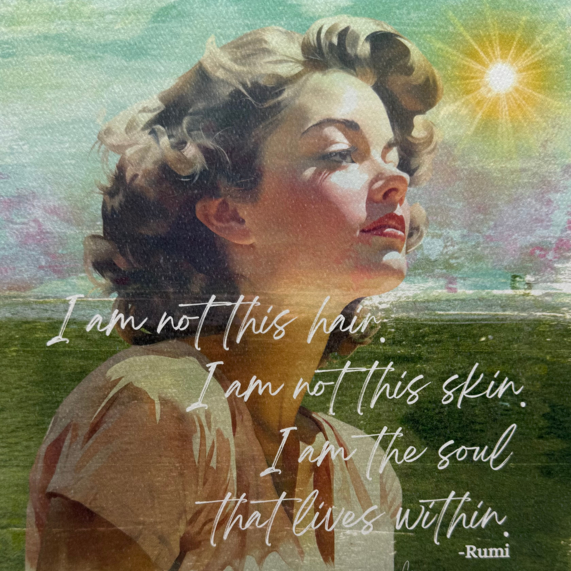 This art print features the top part of a young woman with brown curly hair looking to the right.  She is in front of a hand-painted scene with green ground and a blue/green/purple sky and a bright sun in upper right hand corner.  The quote "I am not this hair.  I am  not this skin.  I am the should that lives within" by Rumi is in white cursive on top of the young lady and grass 
