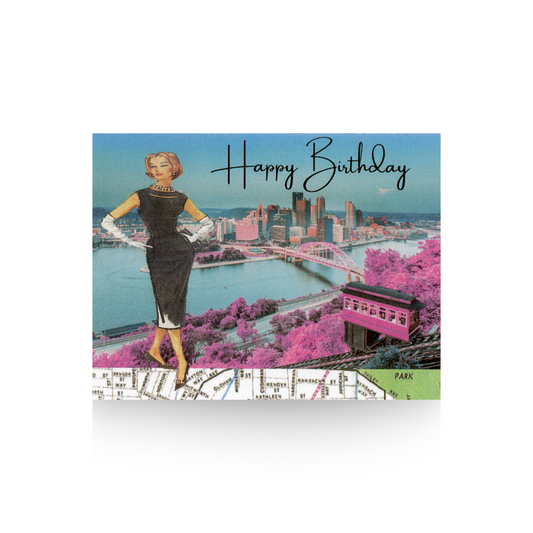 This birthday card features a vintage lady in a black cocktail dress standing with her hands on her hips.  She is standing in front of a scene of Mt. Washington and the incline in the spring time looking down at the city of Pittsburgh.  Happy Birthday is written in the sky to the right of the lady and over the city scene