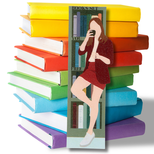 This photo shows a stack of bright colored books with a bookmark in front featuring a woman in a short skirt and blazer drinking a cup of coffee leaning against the bookcase.  On the bookshelves is written the message "Books set you free."