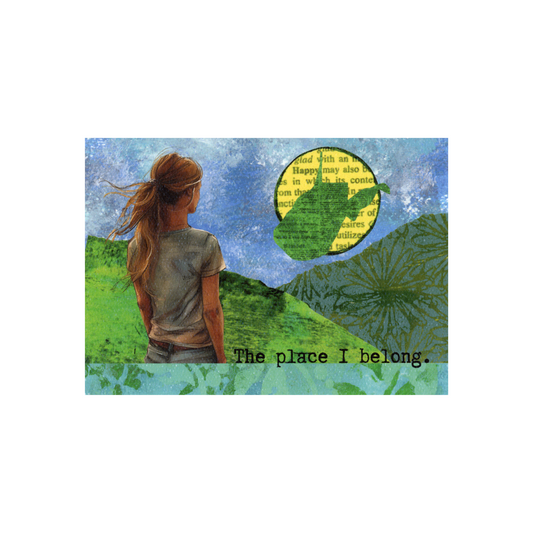This print of a digitally designed collage features a woman with long brown hair in a ponytail  wearing a gray short sleeved shirt  looking away at mountains made of printed paper set against a blue painted sky.  In the top right portion of the collage is a yellow word sun overlayed with a green West Virginia state outline.  The phrase "The place I belong" sits to the right of the woman and there is a green printed border at the bottom
