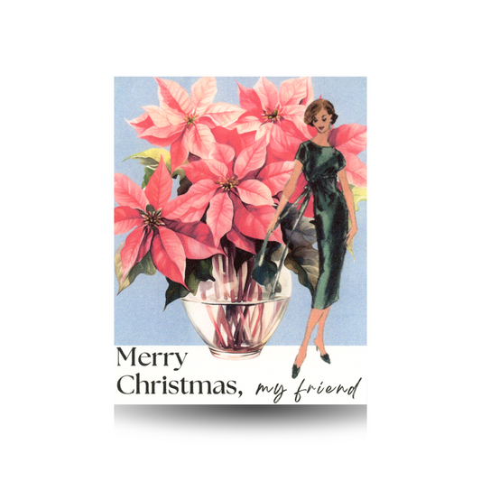 Christmas card with a vintage woman in a green dress standing beside a pink poinsettia against a blue background, with the message  'Merry Christmas, my friend' at the bottom in the white space 