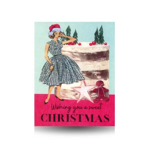 Vintage-style Christmas card with a vintage woman in a black and white checked dress wearing a Santa hat, standing next to a cake, featuring text 'Wishing you a sweet Christmas'.