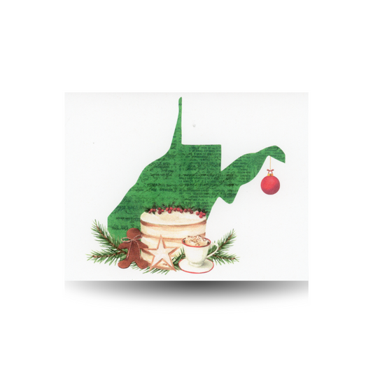 This notecard features the outline of the state of West Virginia in green, with a Christmas cake, cup of cocoa, and Christmas cookies settled at the base of the state.  A red Christmas bulb hangs off the right side of the state outline.  The background is white.