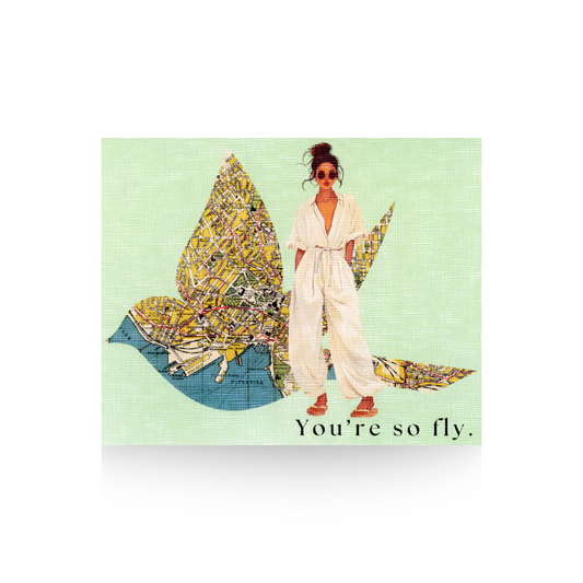 this greeting card is 4.25 x 5.5 inches.  It features a modern lady with a cream jumpsuit and sandals on.  She has dark hair that is in a bun and is wearing sunglasses.  Her hands are in her pockets.  She is standing in front of a large bird outline cut out of a vintage map.  The background is light green