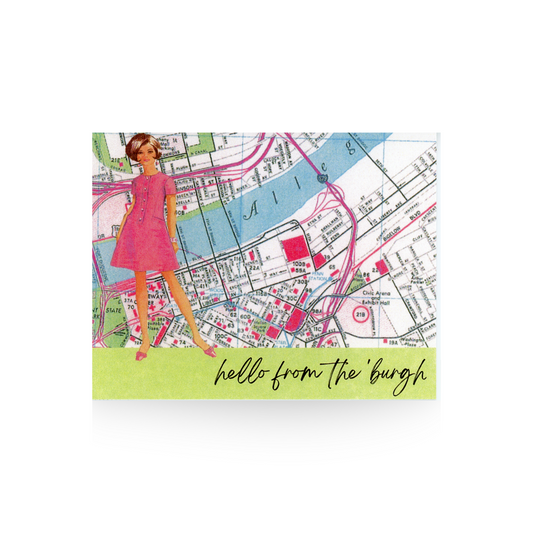 This "hello from the 'burgh" card features a vintage map of Pittsburgh as the background.  Standing in front on a light green base is a vintage woman with a short bob haircut and a short pink dress.  the message is written in cursive font on the green base of the card
